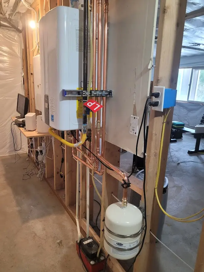 Licensed plumber repairing a kitchen sink in Orono